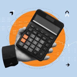 Business,And,Financial,Concept.,Hand,Holding,A,Black,Calculator,Against Associations : la franchise des impôts commerciaux est revalorisée