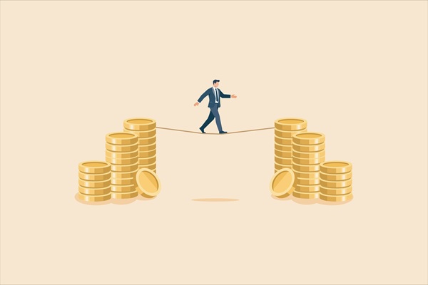 Businessman,Walking,On,A,Tightrope,Between,Piles,Of,Gold,Coins, Lois de finances 2027 : tour d’horizon des principales mesures fiscales et sociales intéressant les entreprises